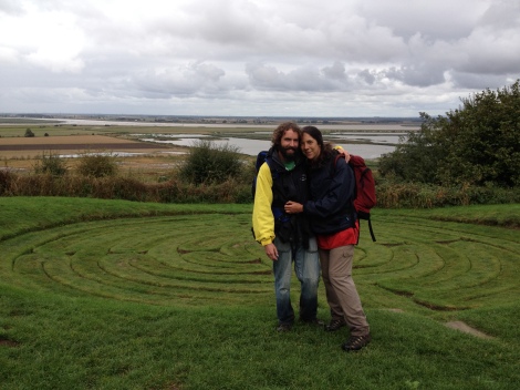 Me and Ross standing by a turf-cut maze, with the confluence of the rivers behind us in the distance.